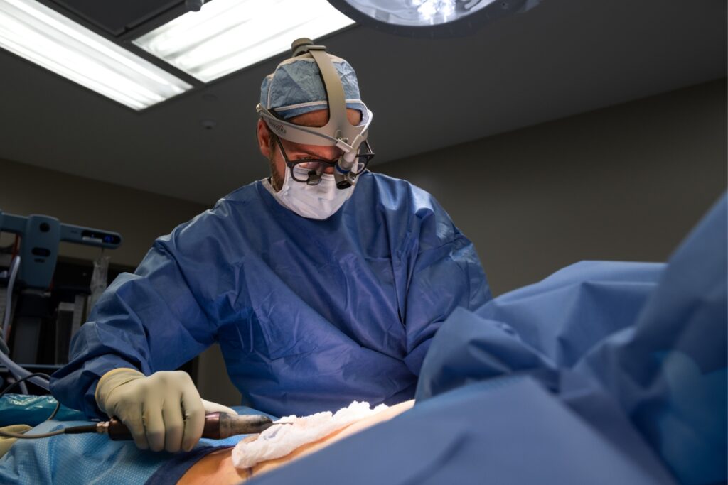 Dr. Bloom Performing Liposuction during an abdominoplasty